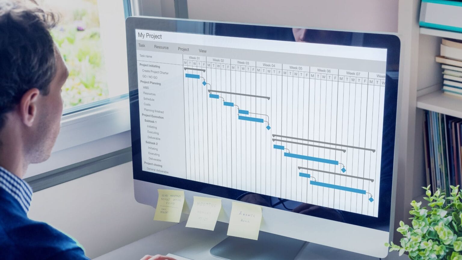 Businessman looking at an onscreen flow chart