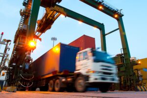 A semi-truck exiting a distribution facility