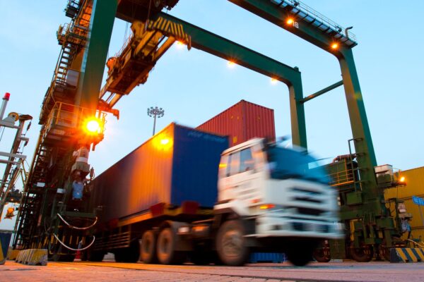 A semi-truck exiting a distribution facility