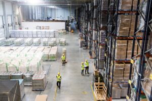Busy warehouse workers viewed from above