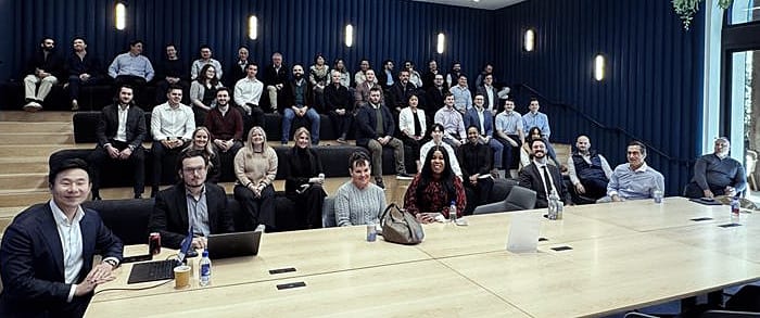Auditorium hall full of people hearing a presentation