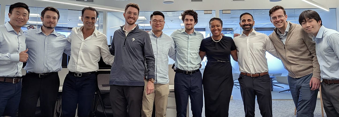 Team members posing in a line